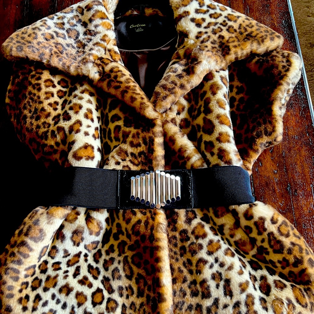Beautiful faux fur vest. Lined. 2 closures with belt.  Worn once.